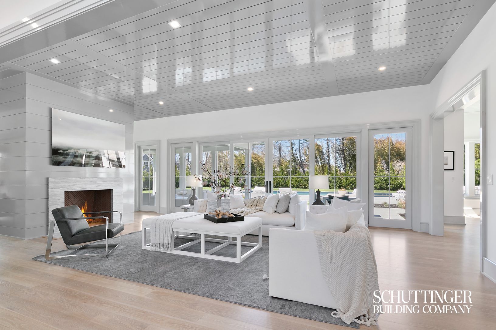  Great Room with Fireplace w/ Stone Surround and High Gloss Shiplap Paneling on Fireplace and Ceiling