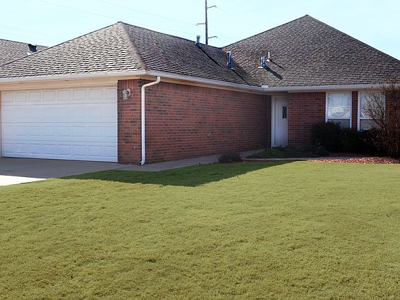 Front yard & 2-car garage