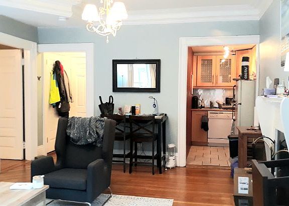 Living room leading to kitchen & bath