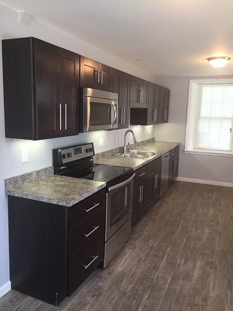 Galley Kitchen - Stainless range and Dishwasher. Built in microwave oven