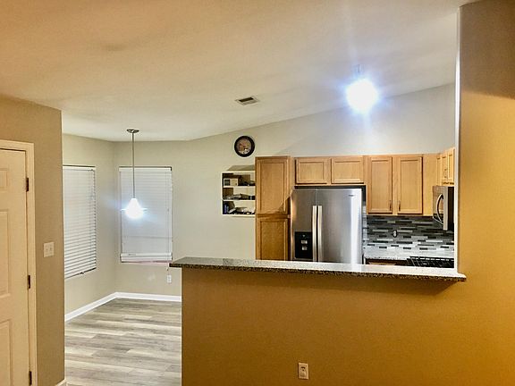 Large eating area for table right next to the kitchen