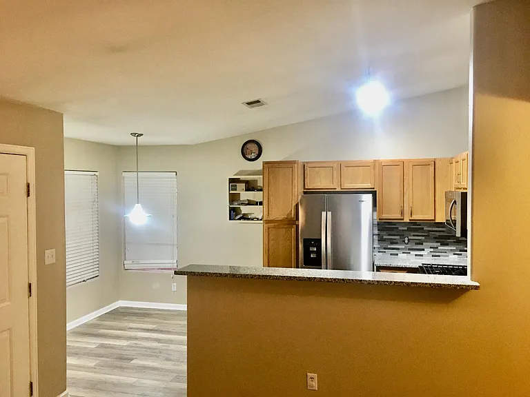 Large eating area for table right next to the kitchen
