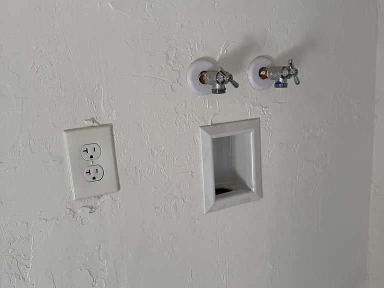 Wash and dryer hookups in storage