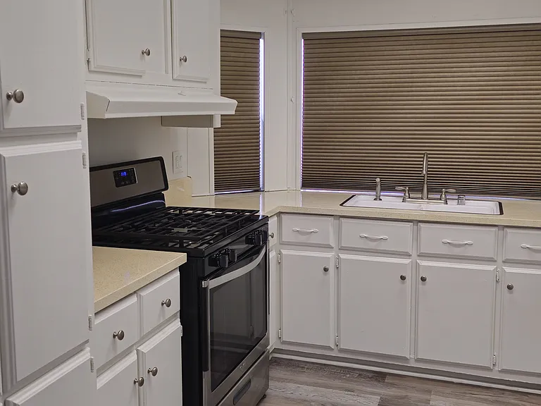 Kitchen with lots of storage and cabinets and stainless steeve gas oven