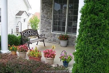 Welcoming Stone Front Colonial Porch