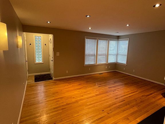 Light and bright with can lights, sconces and lots of windows!