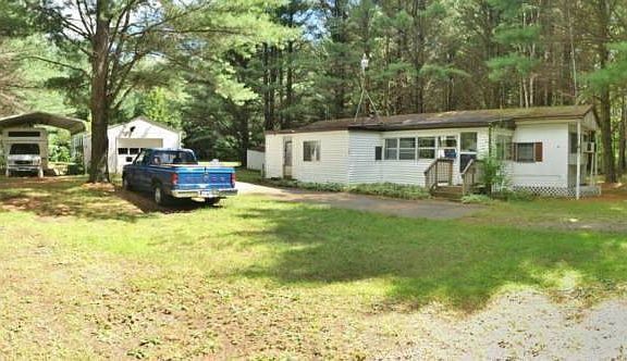 The mobile home has no value but works great for a hunting camp. A full kitchen with three beds, a full bath and laundry are nice to have at deer camp. 