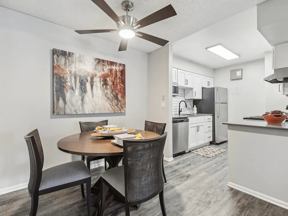 Kitchen dining area with a overhead fan