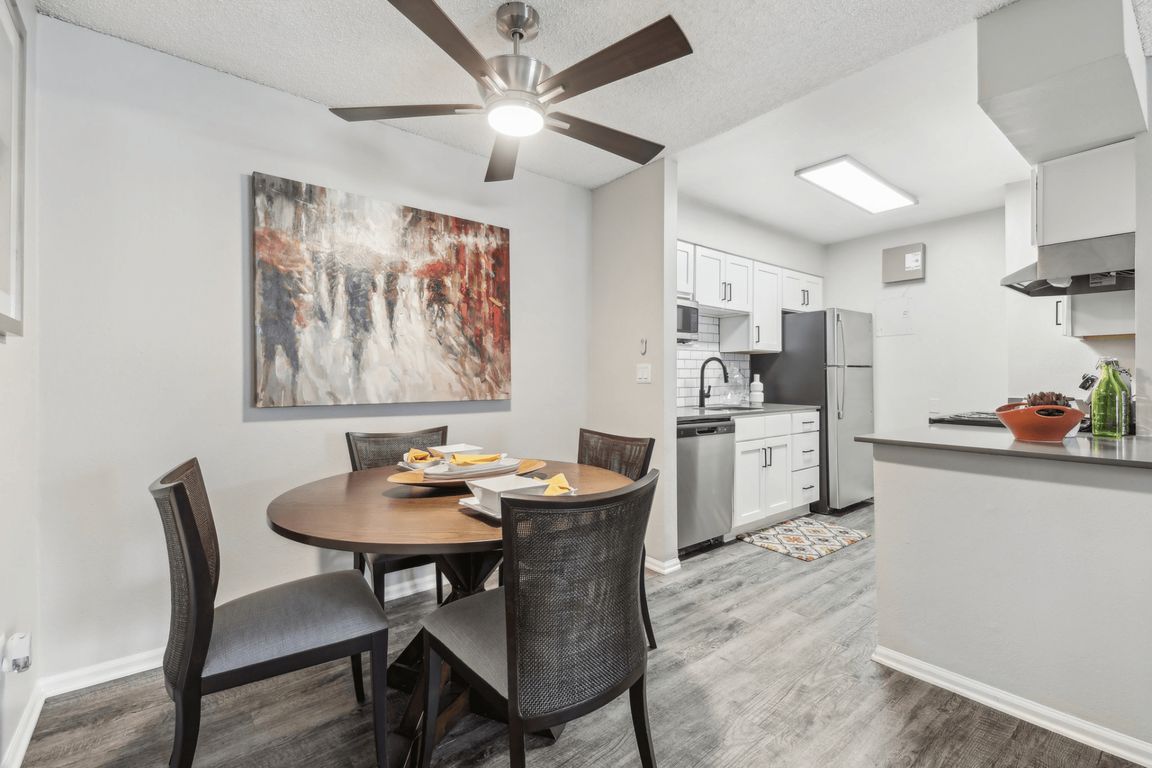 Kitchen dining area with a overhead fan
