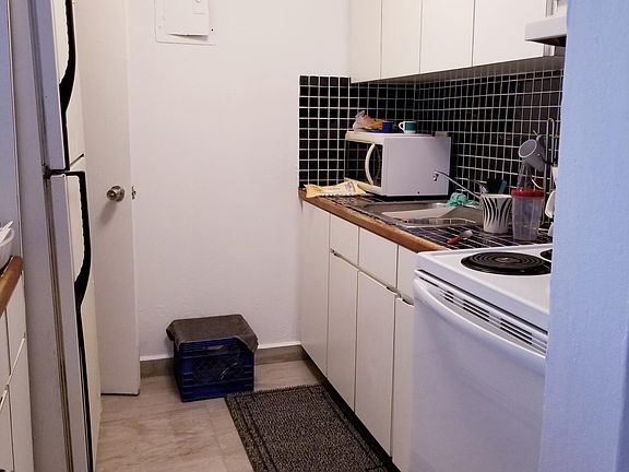 large separate kitchen with a large refrigerator