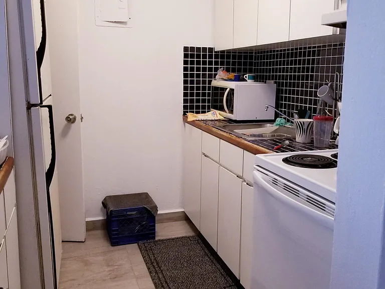 large separate
kitchen with a large refrigerator