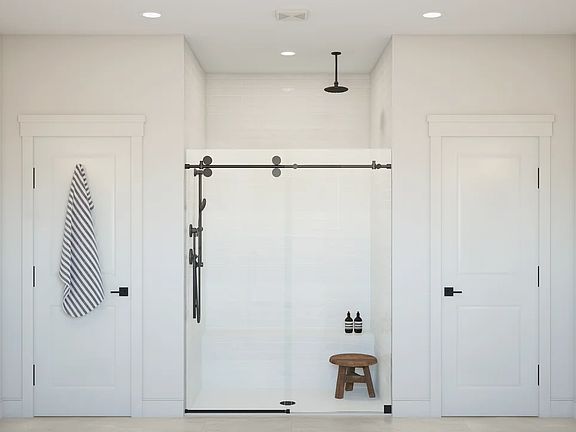 Primary bath with glass shower enclosure