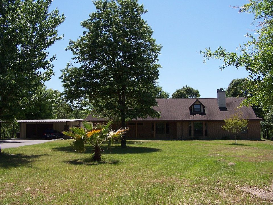 Main home - 2800 s.f., 3/4 BR, 2.5 baths, 800 s.f. porches, huge rock f/p