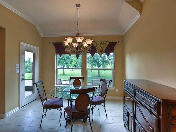 Delightfully open feeling for informal breakfast dining, with natural light.