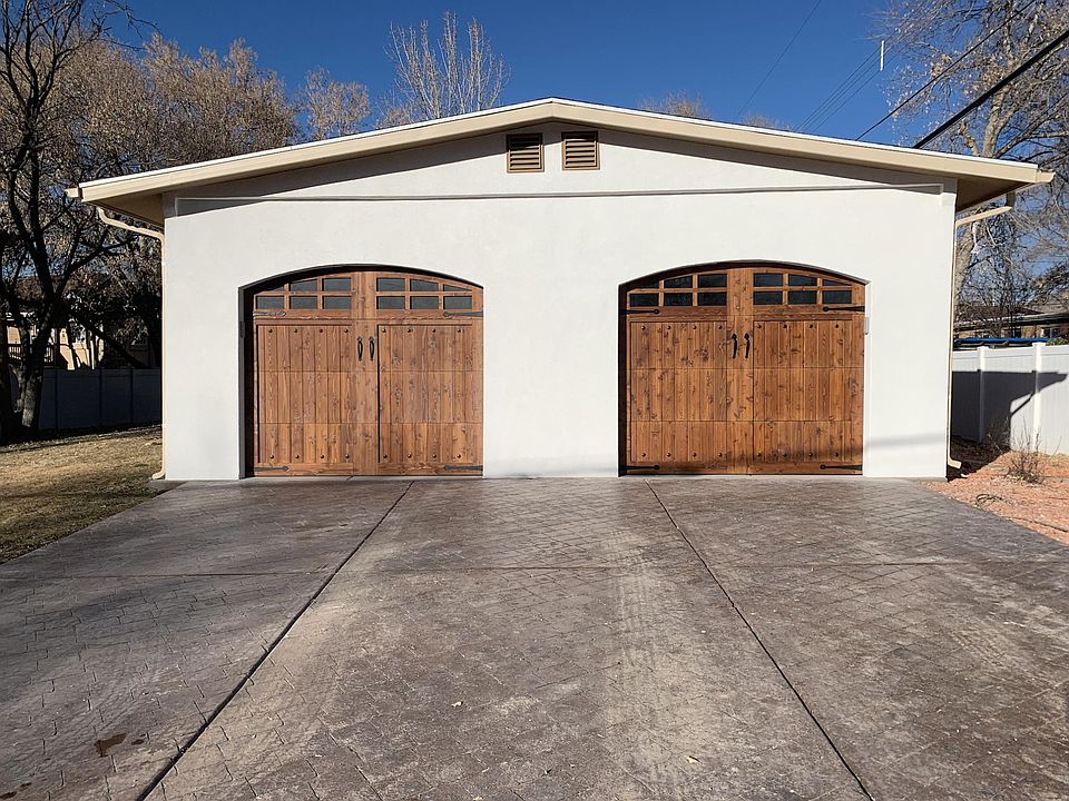 View from the street. The right garage is for Unit B (a private, 1-car garage with a side door leading to the back entrance)