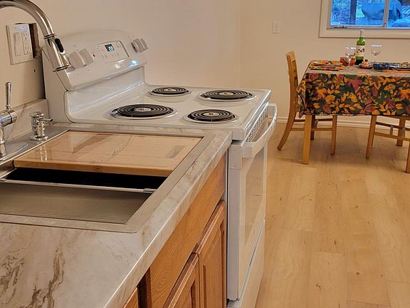 Kitchen view looking toward the dining table and the window to enjoy your morning coffee.
Furniture can be moved depending where you want your bed.