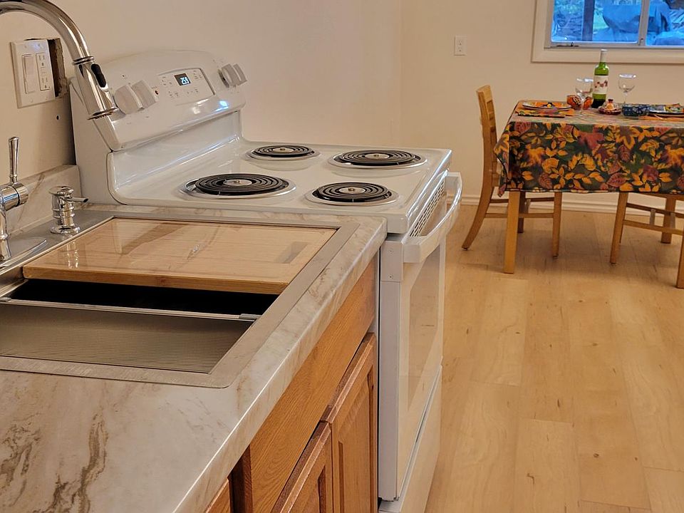 Kitchen view looking toward the dining table and the window to enjoy your morning coffee.
Furniture can be moved depending where you want your bed.