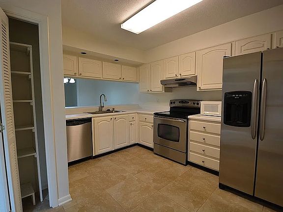 Kitchen to the right of the entry