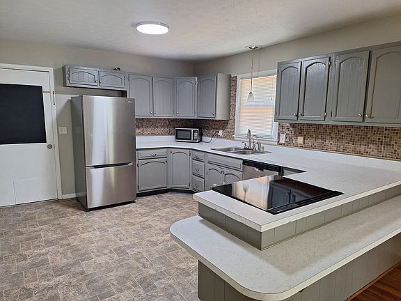 Kitchen with new refrigerator, stove and dishwasher