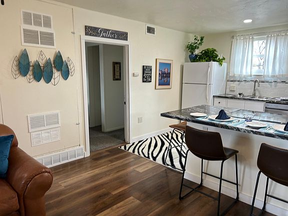 kitchen/living room to bedroom and bathroom entrance with full laundry