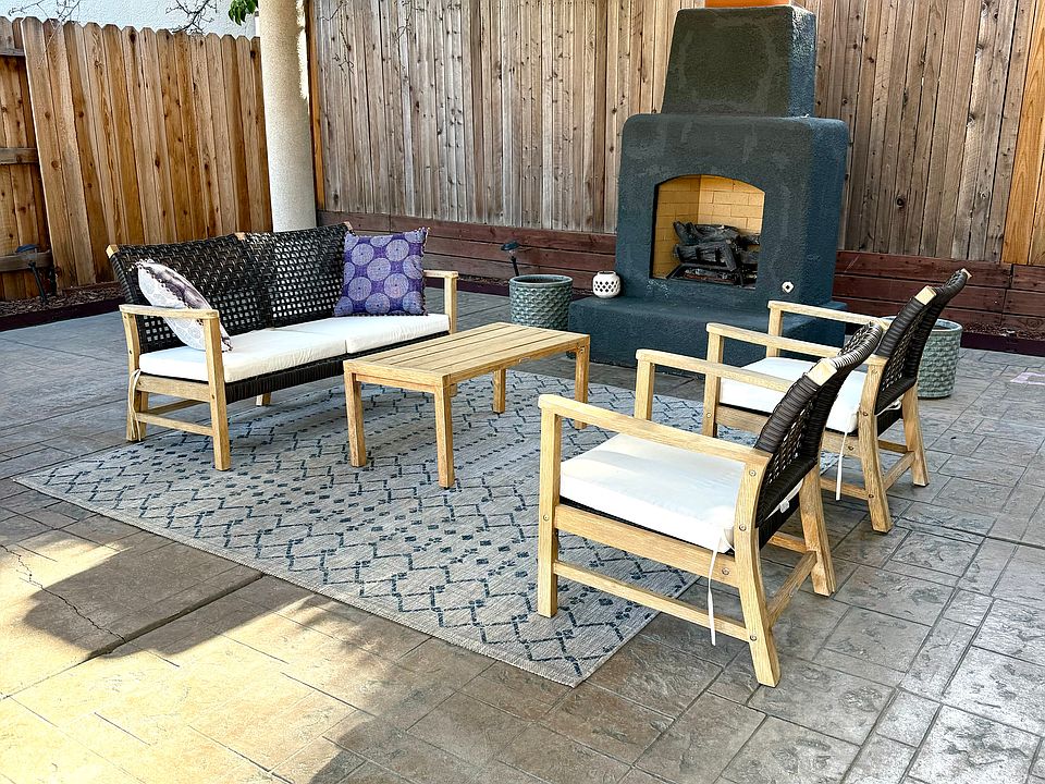 Year-round entertaining under the pergola with built-in BBQ and outdoor fireplace.
