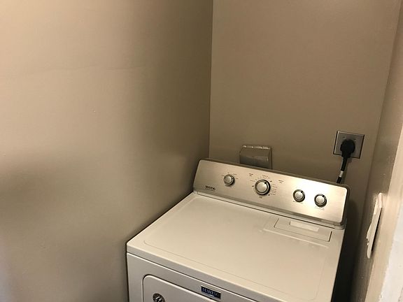 First floor laundry room off the kitchen.