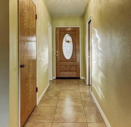 Entryway. Hallway includes entry to first bathroom and storage