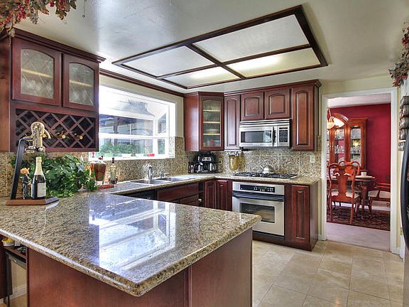 Remodeled Kitchen with Granite Counters &amp; Travertine Floors