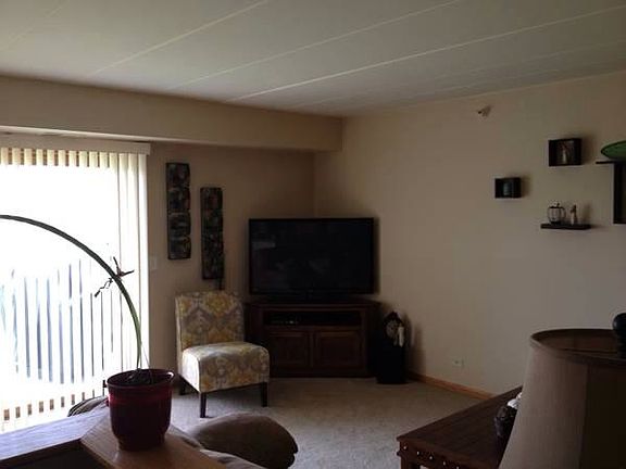 Main living room with sliding doors overlooking preserve