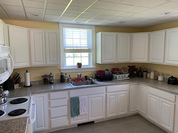 Kitchen with dishwasher to left of stove.