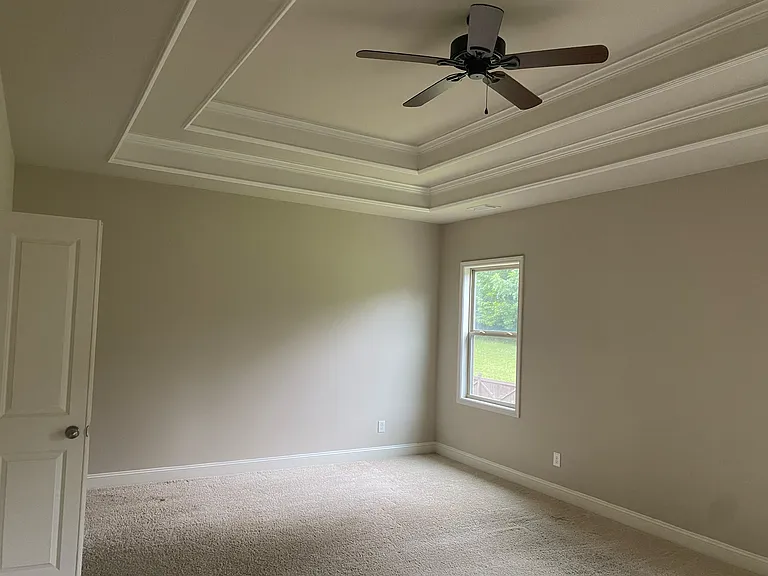 Master bedroom with ceiling Fan