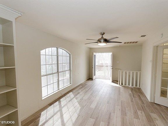ANOTHER VIEW OF LIVING AREA UPSTAIRS WITH FRENCH DOORS TO FLEX ROOM/MASTER BATHROOM AND BEDROOM