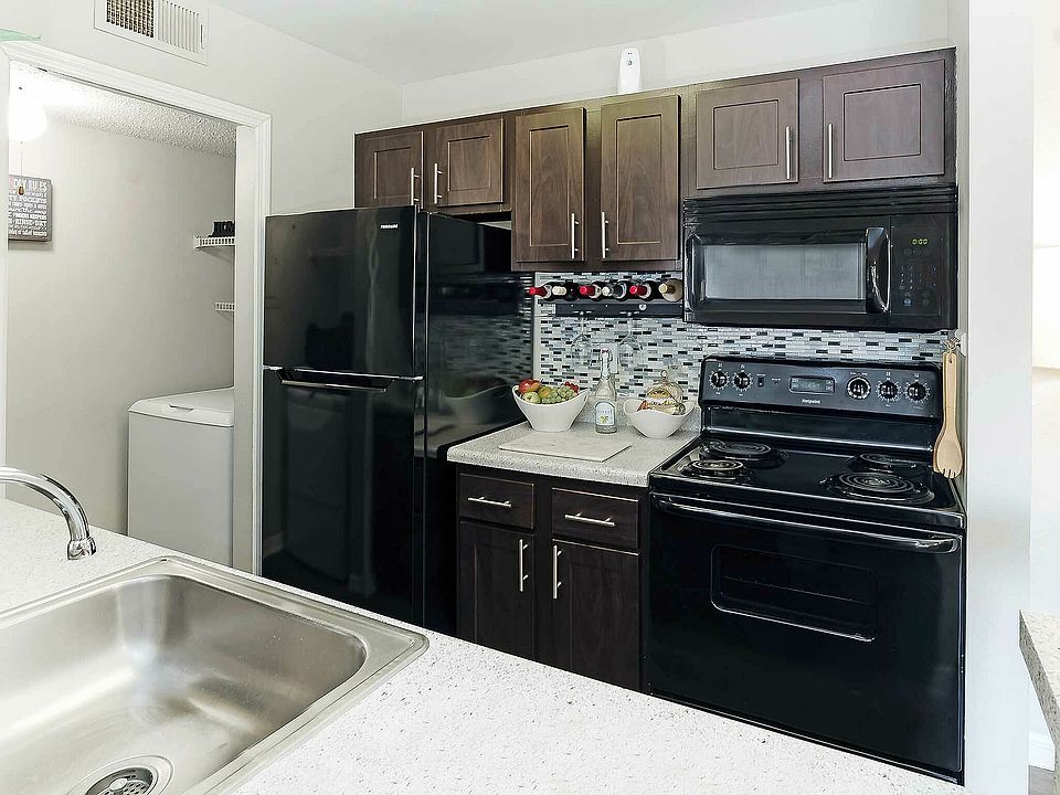 Experience the elegance of this contemporary kitchen, combining style with functionality.