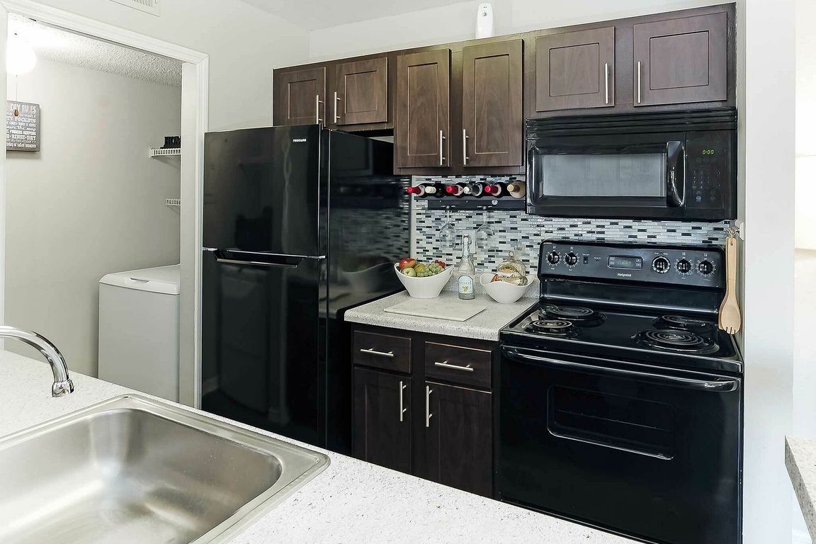Experience the elegance of this contemporary kitchen, combining style with functionality.