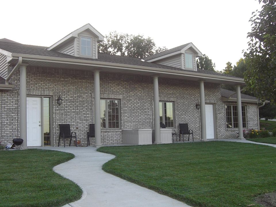 Exterior of building. Unit is on left.