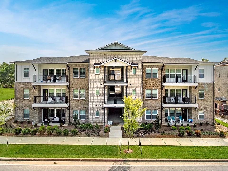 Front of building. Unit features front-facing ground-floor patio.