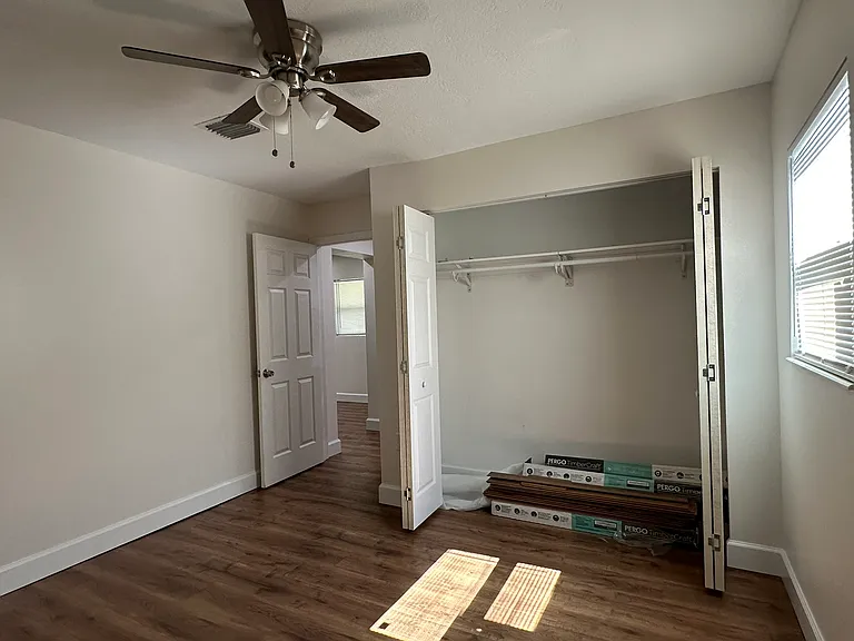 bedroom across from the kitchen