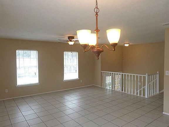 Windows allow natural light into the combination living room & dining room.