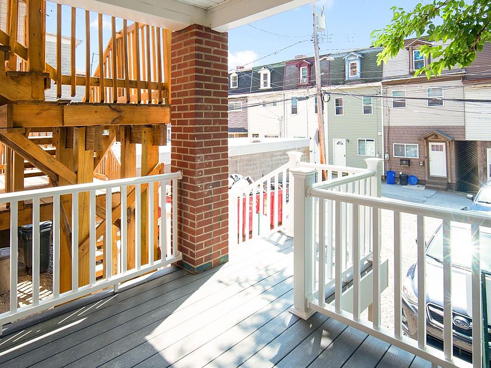 Rear entrance from off street parking area-This deck is a great area to enjoy your morning coffee or relax in the evenings!