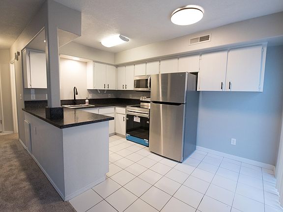 Brand new kitchen granite countertop, appliances, sink, faucets, paint and carpet.