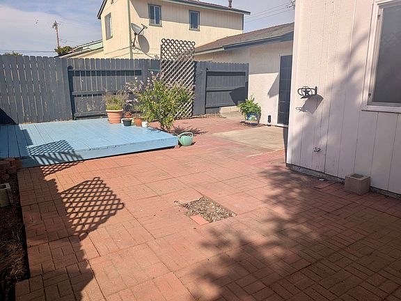 Huge backyard area , pavers and sitting deck.