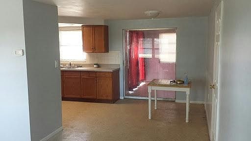 Dining Room / Kitchen with patio sliding doors leading to Florida room.