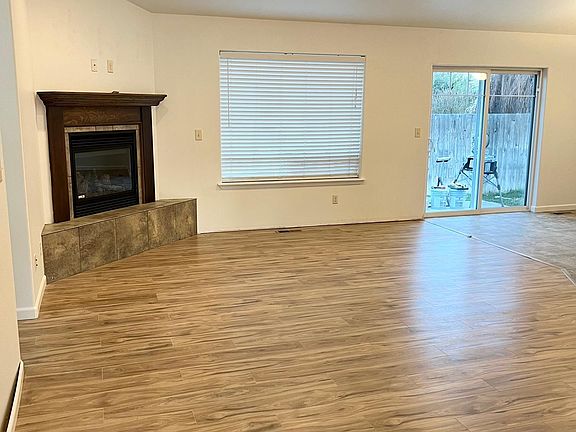 Great room with slider that opens up to fenced back yard