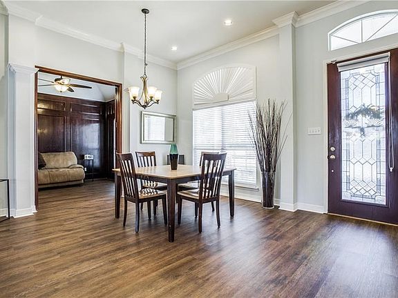 Look at the tall ceilings and tall windows that bring loads of light into this open flowing floor plan.