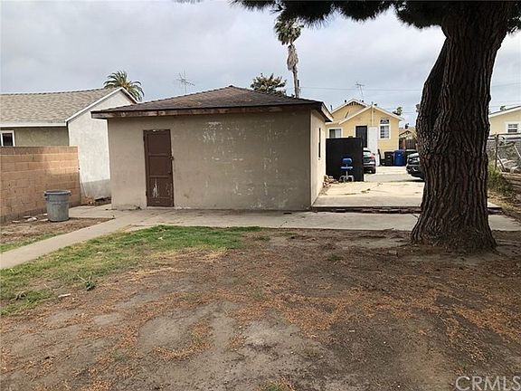 View of the Backyard, 2 Car Garage, and Alley Access