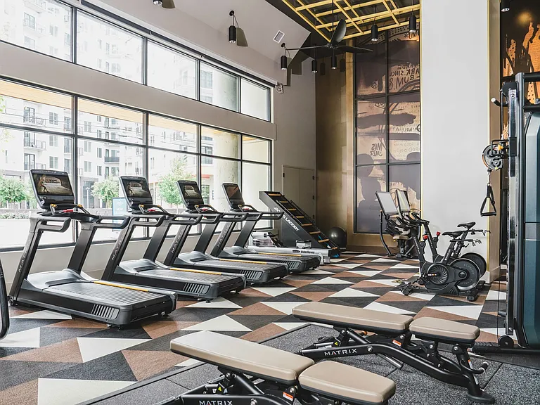 HIIT-Inspired fitness studio with TRX station and spin bikes