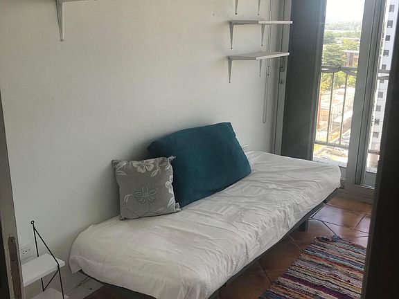 This guest room can also be an office. It has a large built in closet and a balcony with city views.