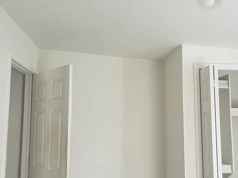 Space between the closet and door in the middle bedroom