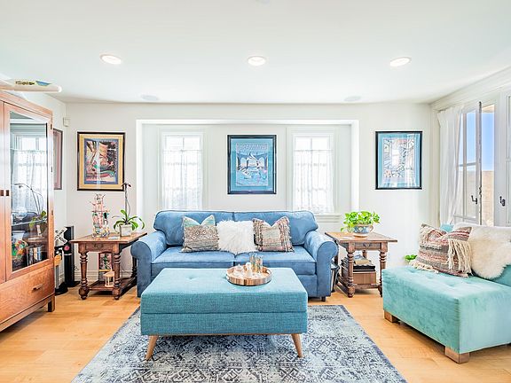 First floor den has a queen sofa bed with innerspring mattress, surround sound system with a 40" Sony Smart LED TV with DVD player and cable.