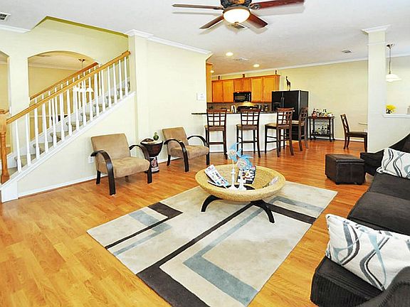 FAMILY ROOM, LOOKING TO THE  KITCHEN, BREAKFAST AREA, & FORMAL DINING.